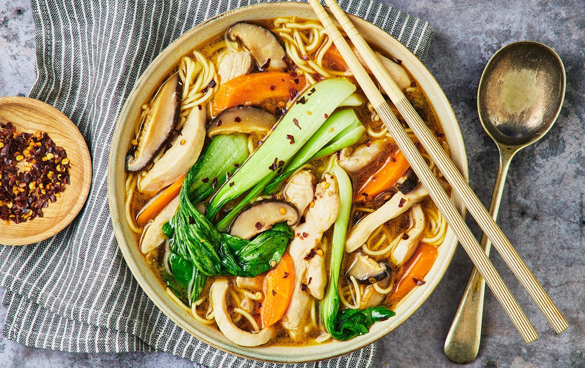 a bowl of noodles and vegetables